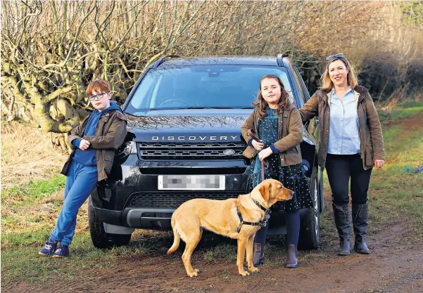  ?? ?? iGeorgina and family with their beloved dog Luna – and their beloved Land Rover