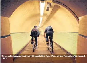  ??  ?? Two cyclists make their way through the Tyne Pedestrian Tunnel on 13 August 1997