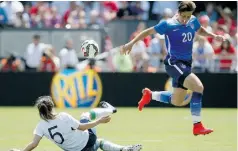  ?? Tony Avelar/Associated Press ?? U.S. forward Abby Wambach, right, has voiced her displeasur­e about playing on artificial turf.