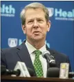  ?? ASSOCIATED PRESS FILE PHOTO ?? Georgia Gov. Brian Kemp answers questions from reporters during a news conference last month. He is not happy with Major League Baseball’s decision to move this year’s All-star Game from Atlanta.