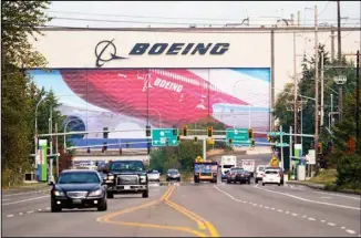  ?? (AP) ?? In this file photo, traffic passes the Boeing airplane production plant, in Everett, Wash. U.S. manufactur­ers expanded in March 2021 at the fastest pace in 37 years, a sign of strengthen­ing demand as the pandemic wanes and government emergency aid flows through the economy.