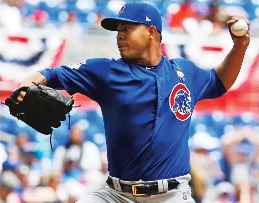  ?? WILFREDO LEE/ AP ?? Left- hander Jose Quintana didn’t allow a hit in the first four innings before the Marlins roughed him up for five runs in the fifth Sunday in Miami.