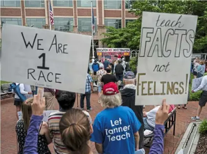  ?? Andrew Caballero-Reynolds/AFP via Getty Images ?? People rallying against ‘critical race theory’ (CRT) being taught in schools in Leesburg, Virginia.