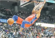  ??  ?? Philadelph­ia 76ers’ Markelle Fultz dunks in the second quarter against he Atlanta Hawks at Philips Arena. — USA TODAY Sports photo