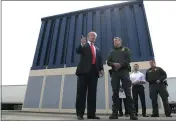  ?? EVAN VUCCI — THE ASSOCIATED PRESS FILE ?? President Donald Trump speaks during as he reviews border wall prototypes, in San Diego, as Rodney Scott, the Border Patrol’s San Diego sector chief, listens.