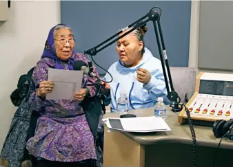  ??  ?? BOTTOM Elder Minnie Aliitchak Gray with Helen Roberts recording voice-over for Never Alone