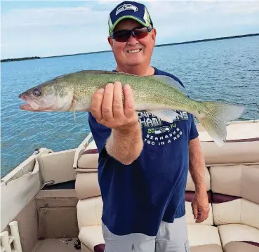  ?? [PHOTO PROVIDED] ?? Rick Williams from Ellensburg, Wash., holds a walleye caught on Canton Lake.