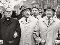  ?? ?? Bishop Howard Hubbard, left, Gov. Mario Cuomo, center, and Mayor Thomas Whalen, right, march in Albany’s annual Martin Luther King Day parade on Jan. 20, 1986.