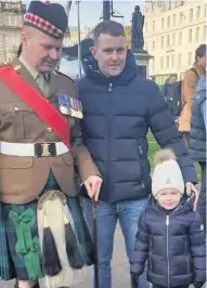  ??  ?? Family man Sgt Major Sammy McFarlane with son Craig and grandson Frankie