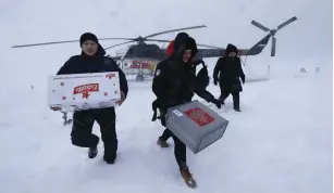  ?? (Sergei Karpukhin/Reuters) ?? ELECTION OFFICIALS arrive on the Pechora Sea island of Kolguyev in Russia’s Nenets Autonomous District on February 28 to bring voting materials to local residents.