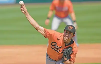  ?? DAVID J. PHILLIP/AP ?? After three dominant innings in which Grayson Rodriguez, throwing against the Tigers on March 2, retired nine of 10 Red Sox with six strikeouts, the Orioles’ top pitching prospect failed to retire any of the five batters he faced in the fourth inning on Sunday.