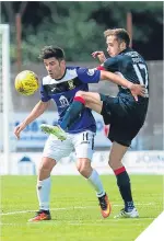  ??  ?? East Fife’s Kyle Wilkie holds off Dundee’s Nick Ross.