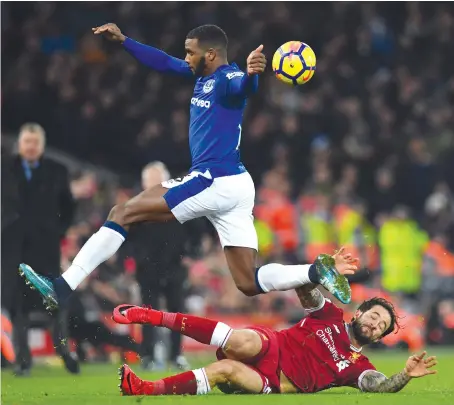  ?? Everton defender Cuco Martina jumps a challenge from Liverpool striker Danny Ings during the sides’ derby clash last year. ??