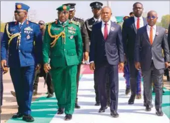  ?? ?? L-R: The Commander, 553 Base Service Group (BSG), Nigerian Air Force, Enugu, Air Commodore S.A Eyoma; the Garrison Commander, 82 Division, Nigerian Army, Enugu, Brig. Gen. Murtala Abu; Governor of Enugu State, Dr. Peter Mbah; and the Speaker, Enugu State House of Assembly, Hon. Uchenna Ugwu, proceed to lay the wreath at the tomb of the Unknown Soldier during the 2024 Armed Forces Remembranc­e Day event at the Okpara Square, Enugu, ... yesterday.