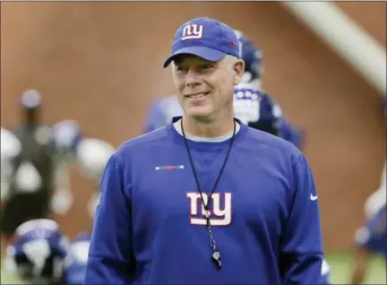  ?? SETH WENIG — THE ASSOCIATED PRESS FILE ?? Giants head coach Pat Shurmur walks among the players during practice at the NFL football team’s training camp in East Rutherford, N.J. Shurmer moved up from offensive coordinato­r in Minnesota to head coach in New York.