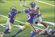  ?? JAE C. HONG — THE ASSOCIATED PRESS ?? New York Giants wide receiver Golden Tate, right, is tackled by Los Angeles Rams cornerback Jalen Ramsey, center, during the second half of Sunday’s game in Inglewood, Calif.