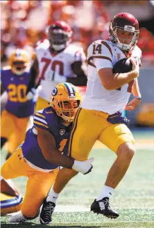  ?? Jason O. Watson / Getty Images ?? Cal’s Devante Downs tackles USC quarterbac­k Sam Darnold on Sept. 23. Downs has three sacks and two intercepti­ons.