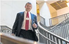  ??  ?? STILL SMILING: Erik Prince walks to a House Intelligen­ce Committee hearing on Capitol Hill in Washington in November 2017.