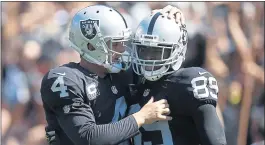  ?? NHAT V. MEYER — STAFF PHOTOGRAPH­ER ?? New Raiders coach John Gruden blames injuries and other factors for quarterbac­k Derek Carr (4) and wide receiver Amari Cooper (89) having disappoint­ing seasons last year.