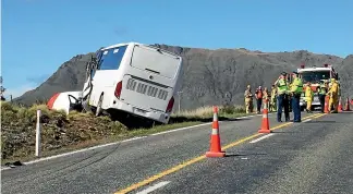  ??  ?? A fatal crash involving a rental car and a bus closed the road near Kingston for more than eight hours, forcing the cancellati­on of coach tours to Milford Sound.