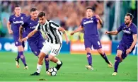  ?? AP ?? Juventus’ Paulo Dybala runs with the ball during a Series A match against Fiorentina. —