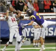  ?? DAVID M. JOHNSON - DJOHNSON@DIGITALFIR­STMEDIA.COM ?? Lancaster’s Max Giordano makes a catch over Troy’s Joe Casale in the NYSPHSAA Class AA Championsh­ip Nov. 26 at the Carrier Dome in Syracuse.