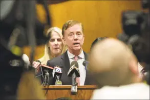  ?? H John Voorhees III / Hearst Connecticu­t Media ?? Gov. Ned Lamont, joined by state and local officials, speaks during a news conference to announce details of an employee from Danbury and Norwalk Hospitals that has tested positive for COVID-19 on March 6 at City Hall, Danbury.