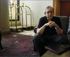  ??  ?? MCM Elegante manager Bill Bianchi talks about the flooding that affected up to 2 feet of the first floor of the hotel in Beaumont, Texas, on Friday. RYAN WELCH/THE BEAUMONT ENTERPRISE VIA AP