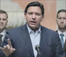  ?? Rebecca Blackwell Associated Press ?? FLORIDA GOV. RON DeSANTIS’ redrawing of the state’s congressio­nal districts is one of the most aggressive­ly partisan gerrymande­rs in the country.