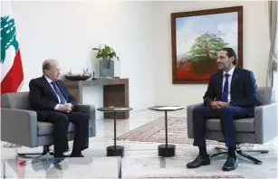  ?? (Dalati Nohra via Reuters) ?? LEBANESE PRESIDENT Michel Aoun meets with Saad Hariri at the presidenti­al palace yesterday.