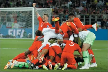  ?? AP PHOTO/ VICTOR R. CAIVANO ?? England players celebrate at the end of the round of 16 match between Colombia and England at the World Cup in the Spartak Stadium, in Moscow, Russia, Tuesday. England won after a penalty shoot out.