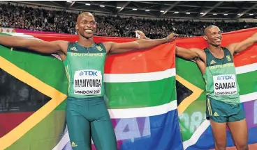  ?? /AFP ?? Dream escape: Luvo Manyonga and Ruswahl Samaai celebrate their medal-winning performanc­es in London on Saturday night. Manyonga won the gold medal with his second leap of 8.48m at the world championsh­ips, while Samaai claimed the bronze on 8.32m.