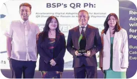  ?? ?? Representa­tives of BusinessWo­rld receive Merit Award for Communicat­ion Skills for work “RecoveryCo­mms - BSP’s QR PH Accelerati­ng Digital Adoption with the National QR Standard for Person-to-Merchant Payments”