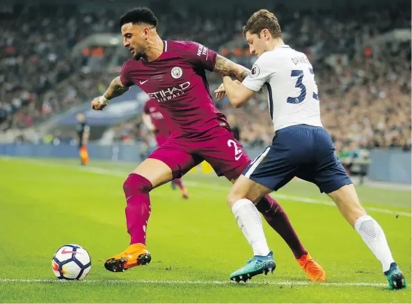  ?? — THE ASSOCIATED PRESS ?? Right back Kyle Walker, left, was just one of the pieces added by Manchester City en route to winning the Premier League title in dominating fashion this season. Walker’s raids up the right wing added a new dimension to City’s attack.