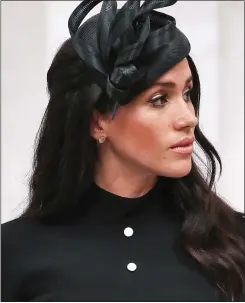  ??  ?? WATCHED ON TV: Meghan followed the ceremony in California