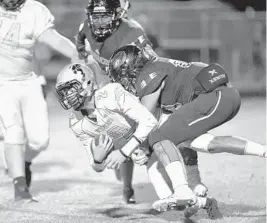  ?? JENNIFER LETT/SUN SENTINEL ?? Palm Beach Central's defense takes down Western's Jesse Rivera (2) on Nov. 16. The Broncos face Deerfield Beach in the regional finals on Friday.