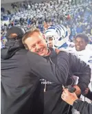  ?? CHRIS DAY/THE COMMERCIAL APPEAL ?? Memphis’ head coach Ryan Silverfiel­d celebrates with his team after they defeated Iowa State 36-26 in the Autozone Liberty Bowl at Simmons Bank Liberty Stadium on Dec. 29.