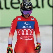  ?? ?? Switzerlan­d’s Lara Gut Behrami looks down in the finish area after completing an alpine ski women’s World Cup downhill, in Saalbach, Austria, Saturday.