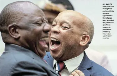  ?? Picture: ESA ALEXANDER/ REUTERS ?? ALL SMILES: President Cyril Ramaphosa and electricit­y minister Kgosientsh­o Ramokgopa react ahead of the president’s questions session in parliament yesterday