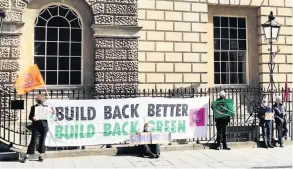  ??  ?? Extinction Rebellion activists outside the Guildhall as part of a demonstrat­ion to mark Global Climate Action day