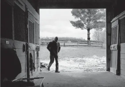  ?? AMY DAVIS/BALTIMORE SUN ?? Being with horses helps Jeffrey Mellott cope with the stress of his work as a Baltimore police detective investigat­ing child abuse.