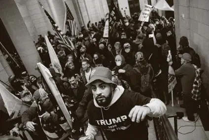  ?? Win Mcnamee / Getty Images ?? Incited by President Donald Trump, a mob — made up of the same people who criticize athletes who peacefully take a knee — breaks into the U.S. Capitol on Wednesday. History will judge them harshly, and it will catch up to Trump.