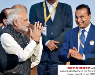  ?? AMIT DAVE/REUTERS ?? SHOW OF RESPECT Anil Ambani with the PM at the Vibrant Gujarat summit in Jan. 2017