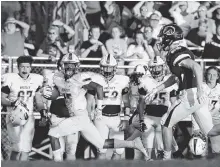  ?? STAFF PHOTO BY ERIN O. SMITH ?? Bradley Central’s Lameric Tucker looks for the closest defender as he heads for the end zone during a game against Walker Valley last month. Tucker has committed to UTC and is looking forward to reuniting with former Bears quarterbac­k Cole Copeland...