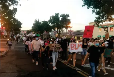  ?? RECORDER PHOTOS BY CHARLES WHISNAND ?? Protestors march down Main Street on Saturday, May 30, 2020.