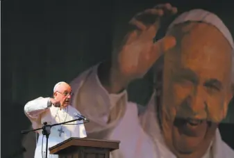  ?? A.M. Ahad / Associated Press ?? Pope Francis delivers a speech at Notre Dame College in Dhaka, Bangladesh. The pontiff urged priests and nuns to resist the “terrorism of gossip” that can tear religious communitie­s apart.