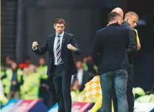  ?? Rex Features ?? Rangers Manager Steven Gerrard celebrates after the final whistle during the match against NK Osijek.