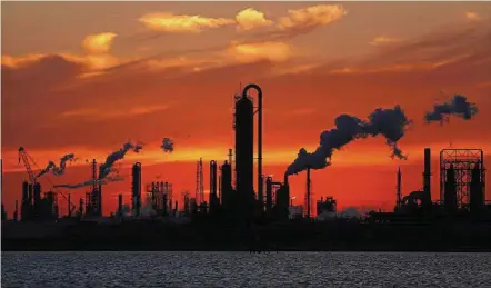  ??  ?? Profit squeeze: Emissions rise from an oil refinery at sunset in Texas City, Texas. Refining margins are looking very shaky, according to a European trader. The crude price also has a major impact on the operating costs of refiners, which consume more...