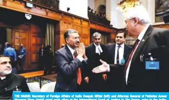  ??  ?? THE HAGUE: Secretary of Foreign Affairs of India Deepak Mittal (left) and Attorney General of Pakistan Anwar Mansoor Khan (right) greet each other at the Internatio­nal Court of Justice in The Hague, prior to the IndiaPakis­tan case yesterday. — AFP