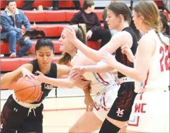  ?? RICK PECK/SPECIAL TO MCDONALD COUNTY PRESS ?? McDonald County’s Rita Santillan steals the ball from a Webb City player during the Lady Mustangs 52-44 loss on Dec. 17 at Webb City High School.